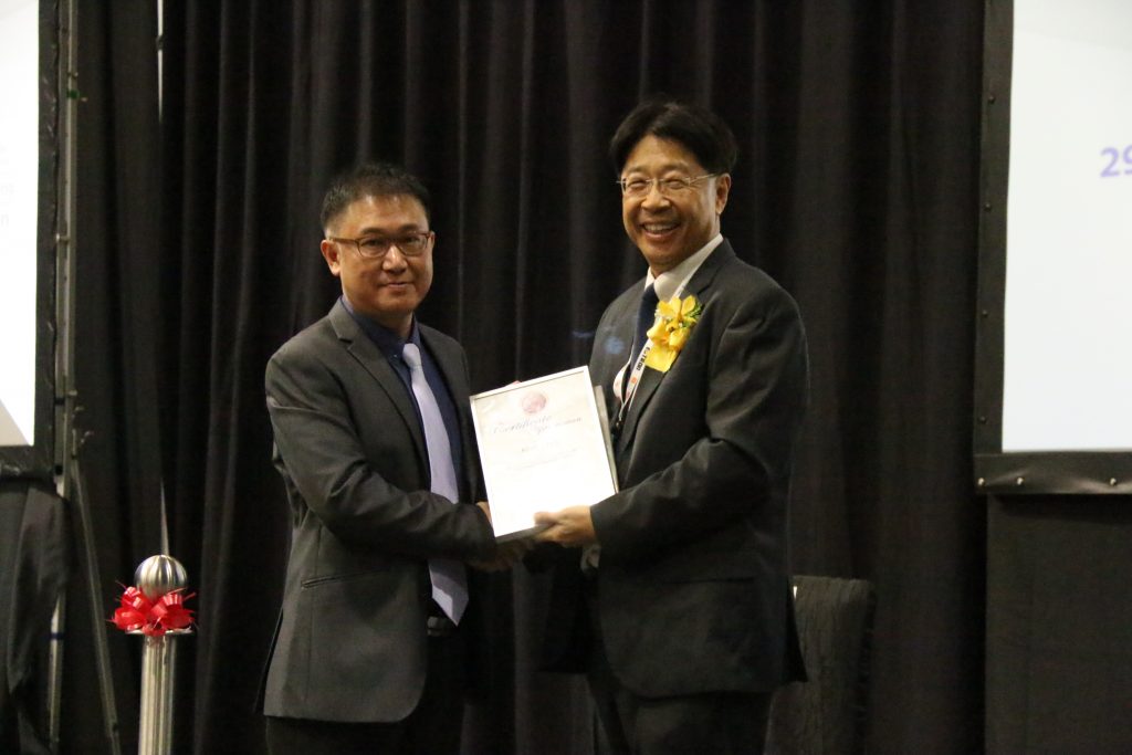 Mr Alan Chua (left) receiving an award during a talk conducted at Safety & Security Asia Exhibition Security Industry Conference 2015 